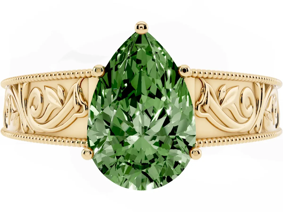 Fancy Green Pear Cut Diamond Solitaire Ring with Engraved Band and Four-Prong Setting Yellow gold