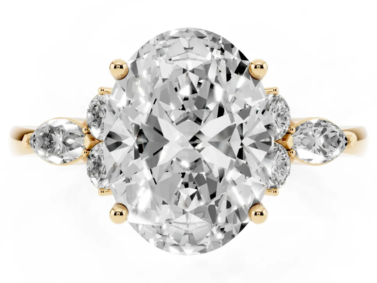 Oval Cut Brilliant Diamond Solitaire Ring with Pear Side Stones and Four-Prong Setting Yellow gold