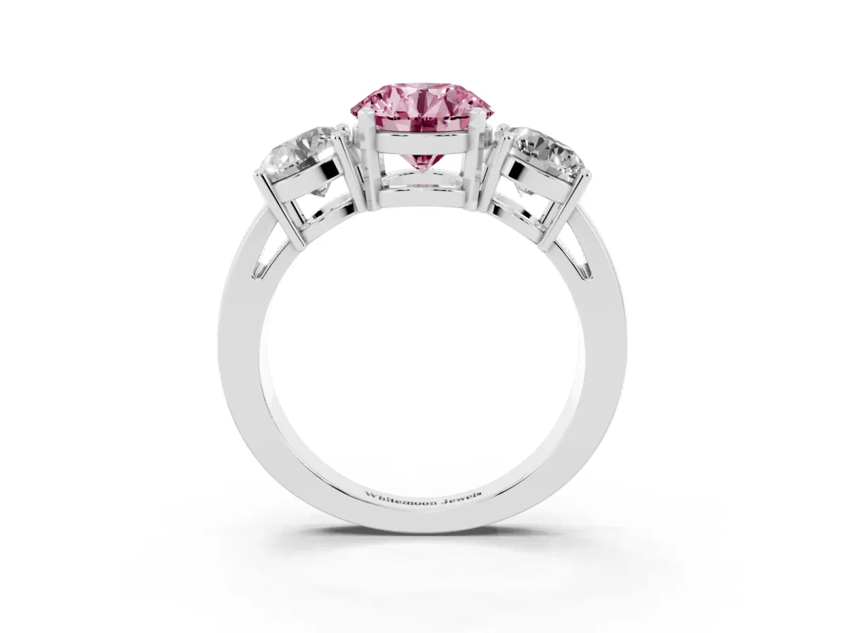 Fancy Pink Three-Stone Round Cut Diamond Ring with Round Side Stones, Classic Band, and Four-Prong Setting Platinum
