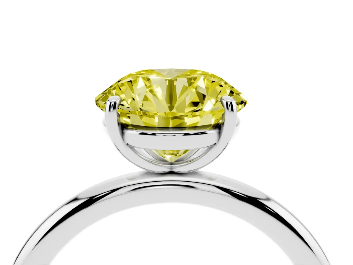 Fancy Yellow Round Cut Solitaire Diamond Ring with Four-Prong Setting on a Plain Band White gold