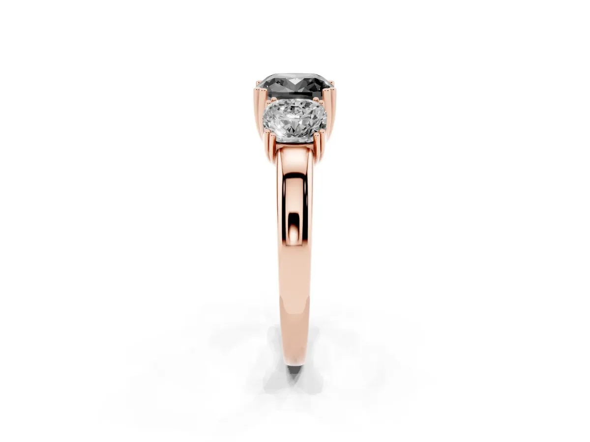 Fancy Black Three-Stone Cushion Cut Cut Diamond Ring with Channel Set Band and Four-Prong Setting Rose gold