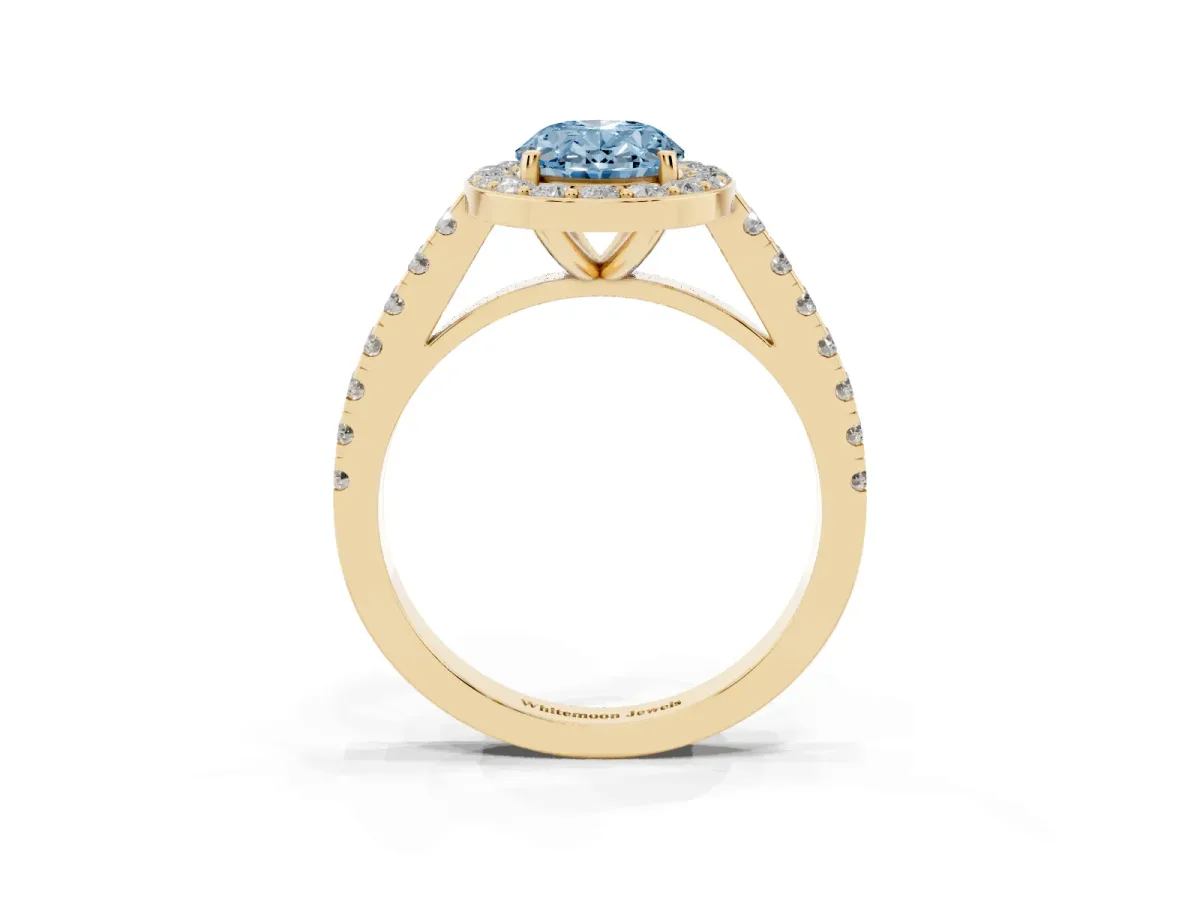 Fancy Blue Oval Cut Diamond Halo Ring with Round Pavé Split Shank and Prong Setting Yellow gold