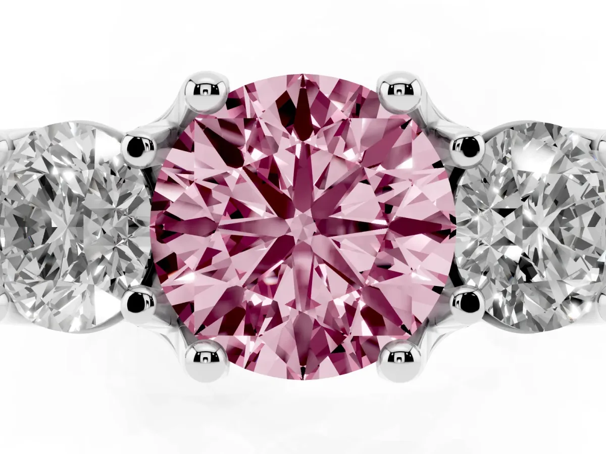 Fancy Pink Round Cut Diamond Three-Stone Ring with Channel Set Band and Four-Prong Setting Silver