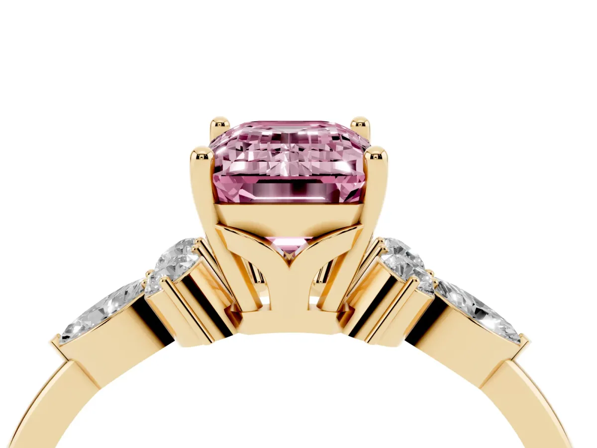 Fancy Pink Emerald Cut Brilliant Diamond Solitaire Ring with Pear Side Stones and Four-Prong Setting Yellow gold