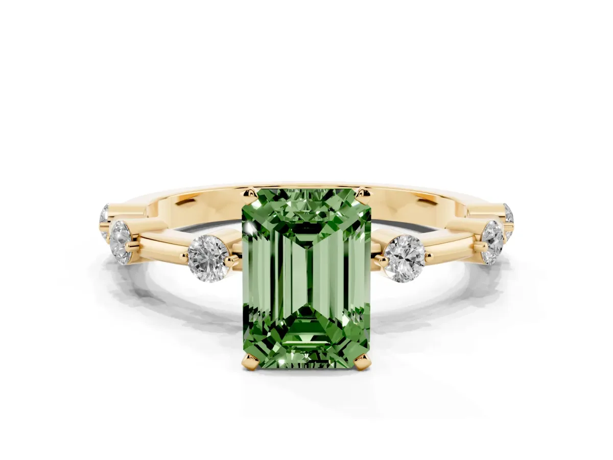 Fancy Green Emerald Cut Solitaire Diamond Ring with Bezel Set Side Stones and Prong Setting Yellow gold