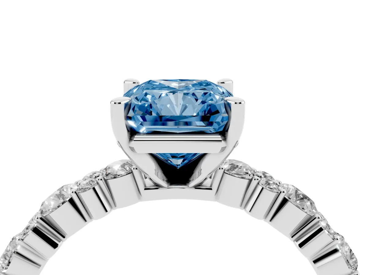 Fancy Blue Radiant Cut Diamond Side Stone Solitaire Ring with Round and Four-Prong Setting Platinum