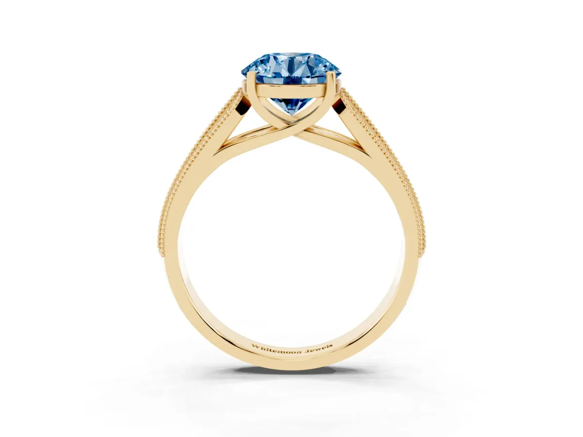 Fancy Blue Round Cut Cut Pave Split Shank Engagement Ring with Four-Prong Setting Yellow gold