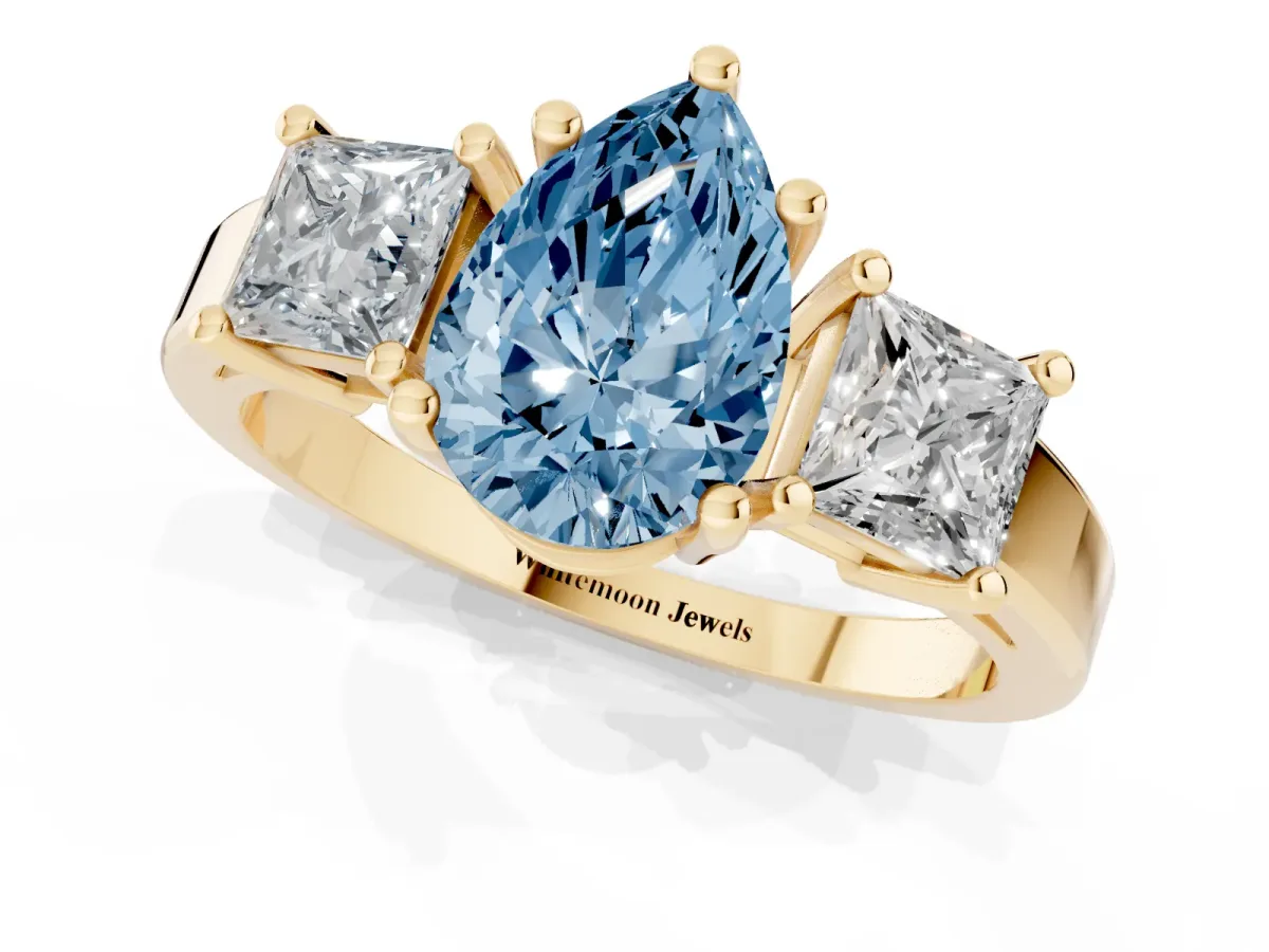 Fancy Blue Three-Stone Pear Cut Cut Solitaire Ring with Prong Setting Yellow gold