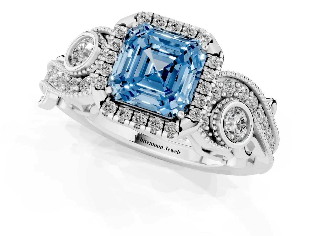 Fancy Blue Asscher Cut Halo Diamond Ring with Milgrain and Bezel Accents on a Split Shank Band Platinum