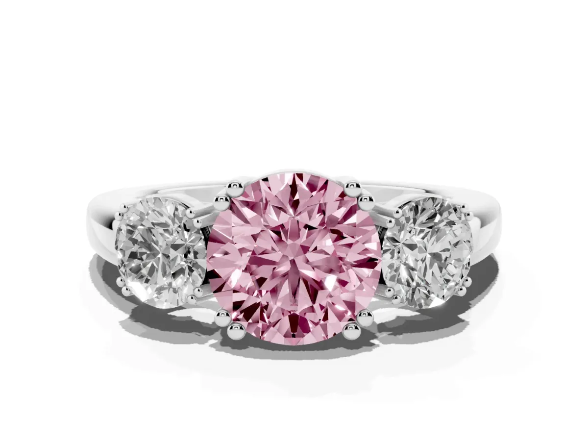 Fancy Pink Three-Stone Round Cut Cut Diamond Ring with Channel Set Band and Four-Prong Setting White gold
