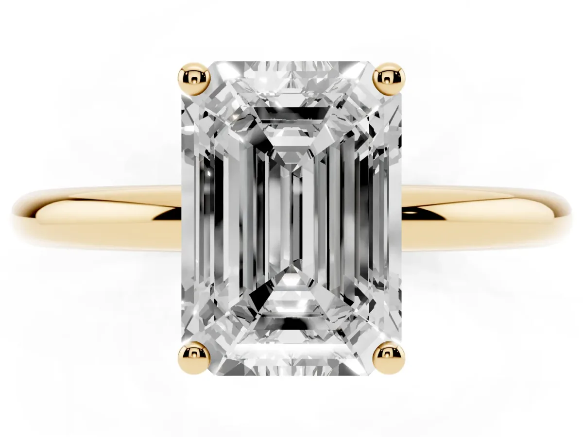 Emerald Cut Cut Solitaire Engagement Ring with Four-Prong Setting and Classic Band Yellow gold