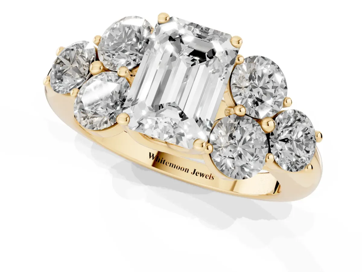 Emerald Cut Cut Diamond Cluster Ring with Round Accent Stones and Prong Setting on a Classic Band Yellow gold
