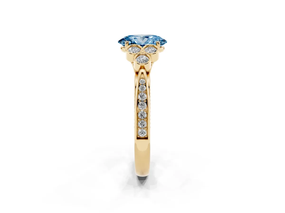Fancy Blue Oval Cut Cut Diamond Engagement Ring with Bezel Set Round Side Stones and Prong Setting Yellow gold