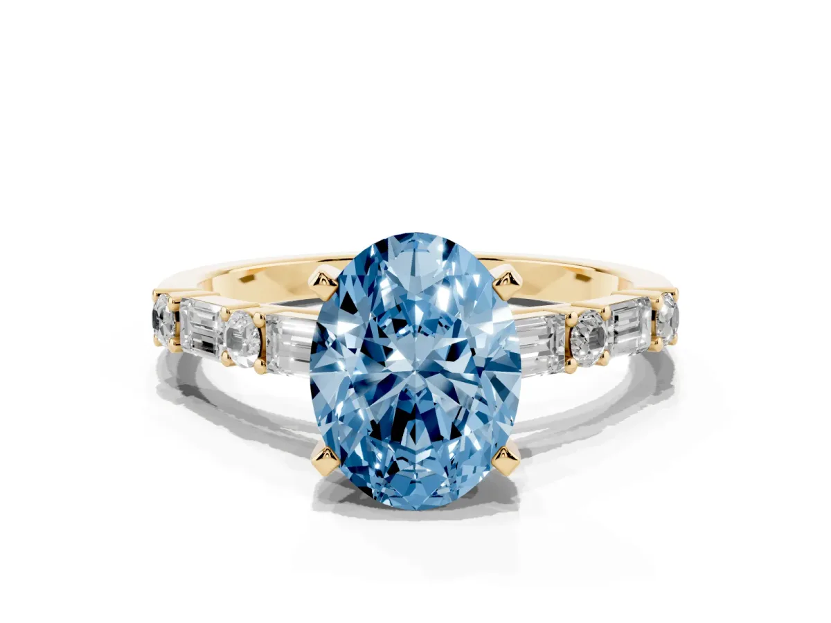 Fancy Blue Oval Cut Diamond Solitaire with Side Baguettes and Channel Set Band Yellow gold