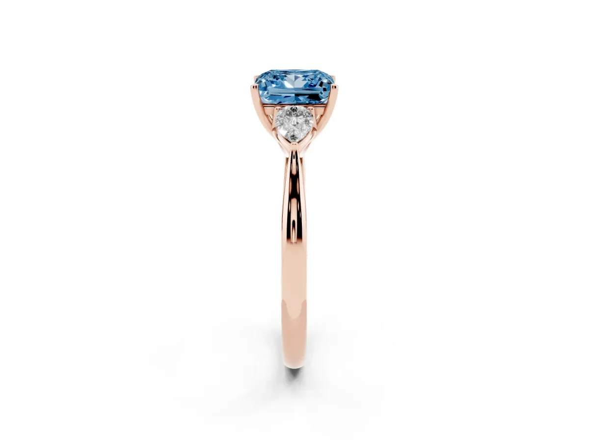 Fancy Blue Three-Stone Princess Cut Brilliant Diamond Solitaire Ring with Tapered Band and Four-Prong Setting Rose gold