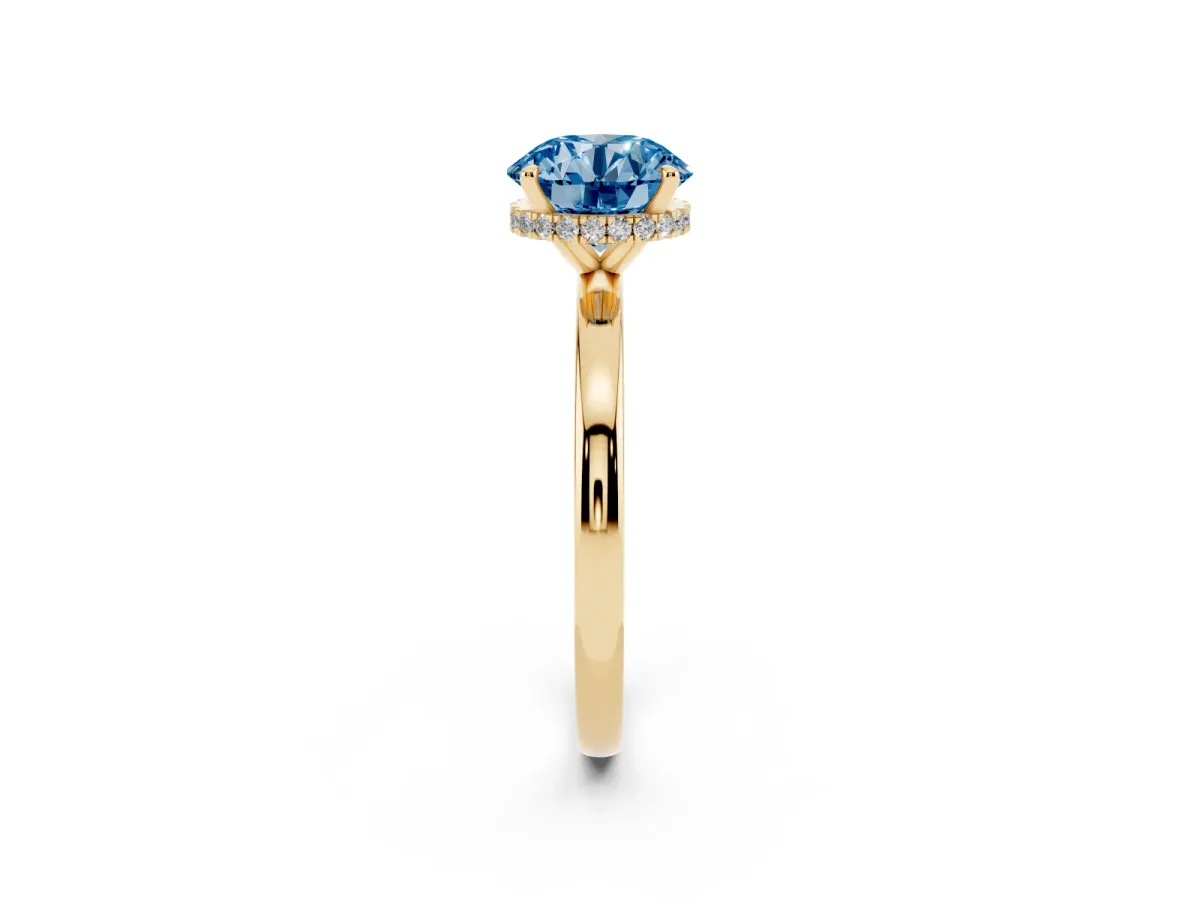 Fancy Blue Round Cut Solitaire Engagement Ring with Cathedral Band and Four-Prong Setting Yellow gold