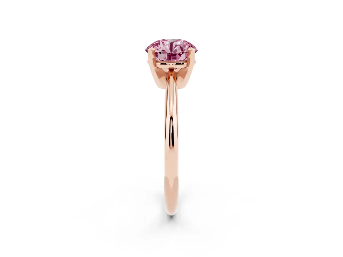 Fancy Pink Round Cut Cut Solitaire Ring with Four-Prong Setting on a Classic Band Rose gold
