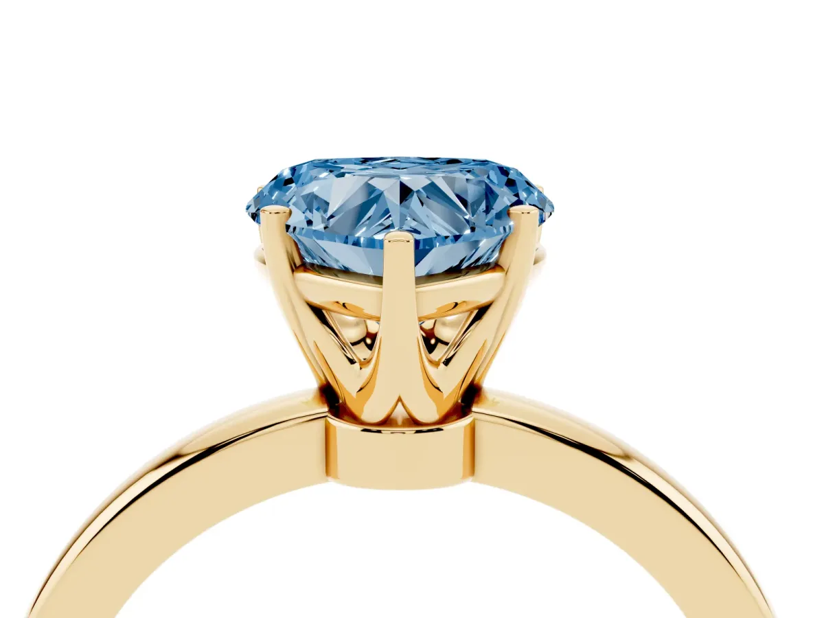 Fancy Blue Heart Cut Solitaire Diamond Ring with Six-Prong Setting on a Classic Band Yellow gold