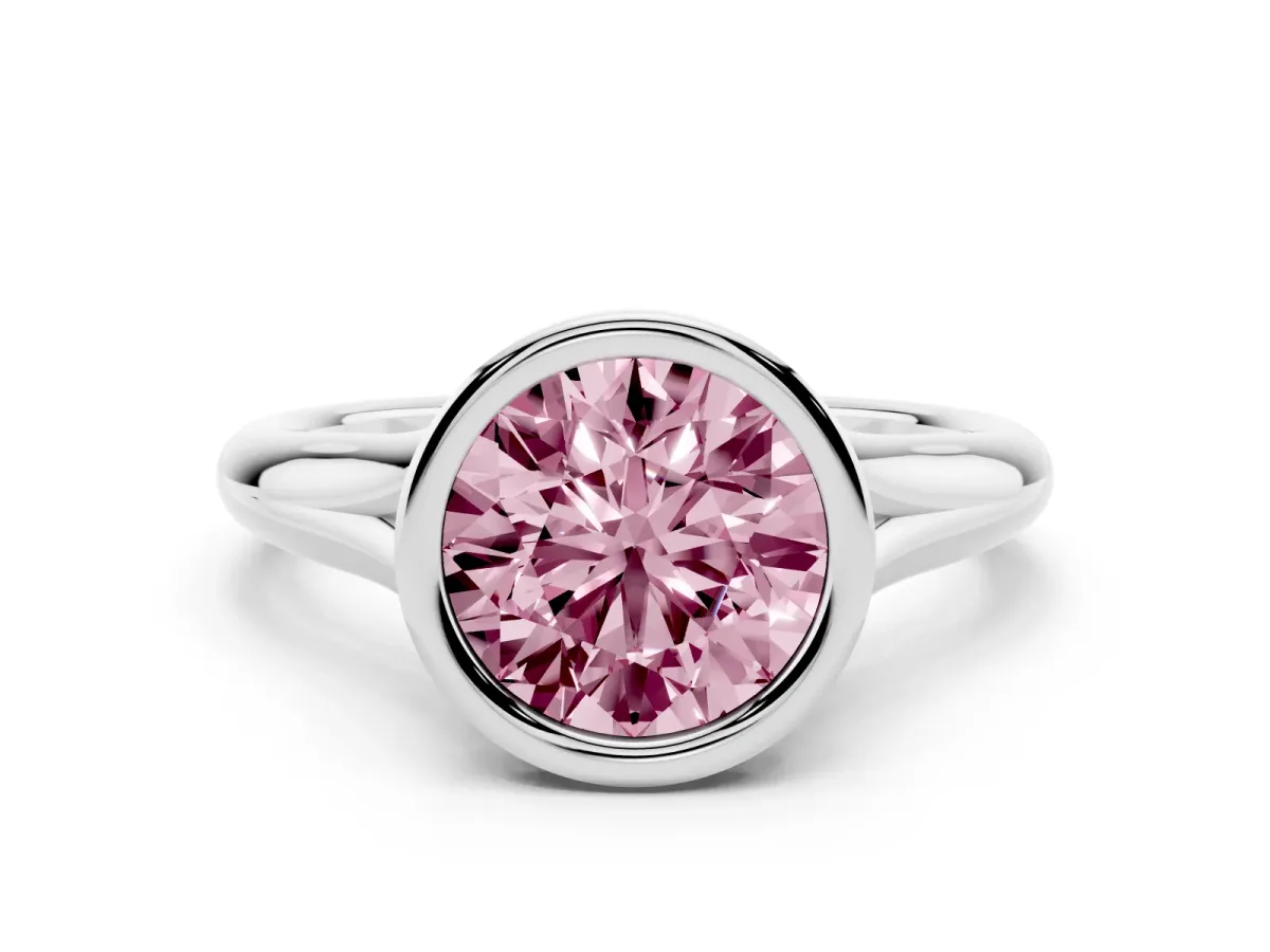 Fancy Pink Bezel Set Round Cut Solitaire Diamond Ring with Smooth Band Silver