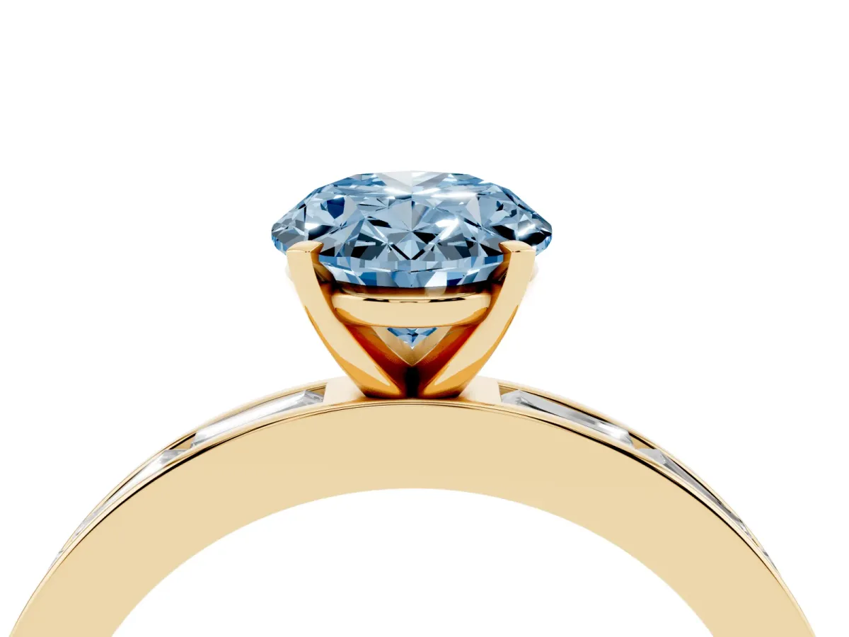 Fancy Blue Oval Cut Solitaire Diamond Ring with Channel-Set Baguette Band and Four-Prong Setting Yellow gold
