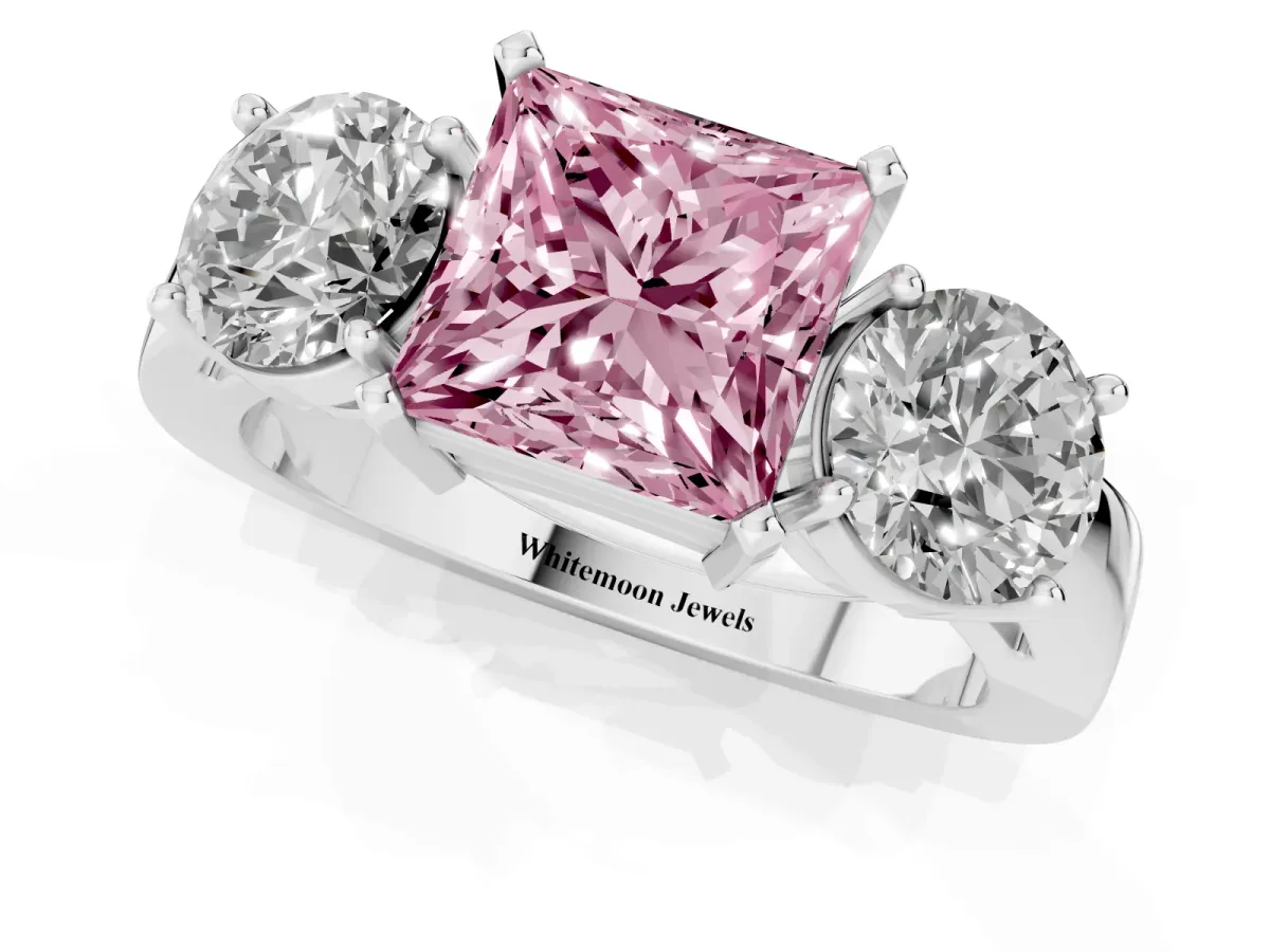 Fancy Pink Three-Stone Princess Cut Diamond Ring with Round Side Stones, Classic Band, and Four-Prong Setting White gold