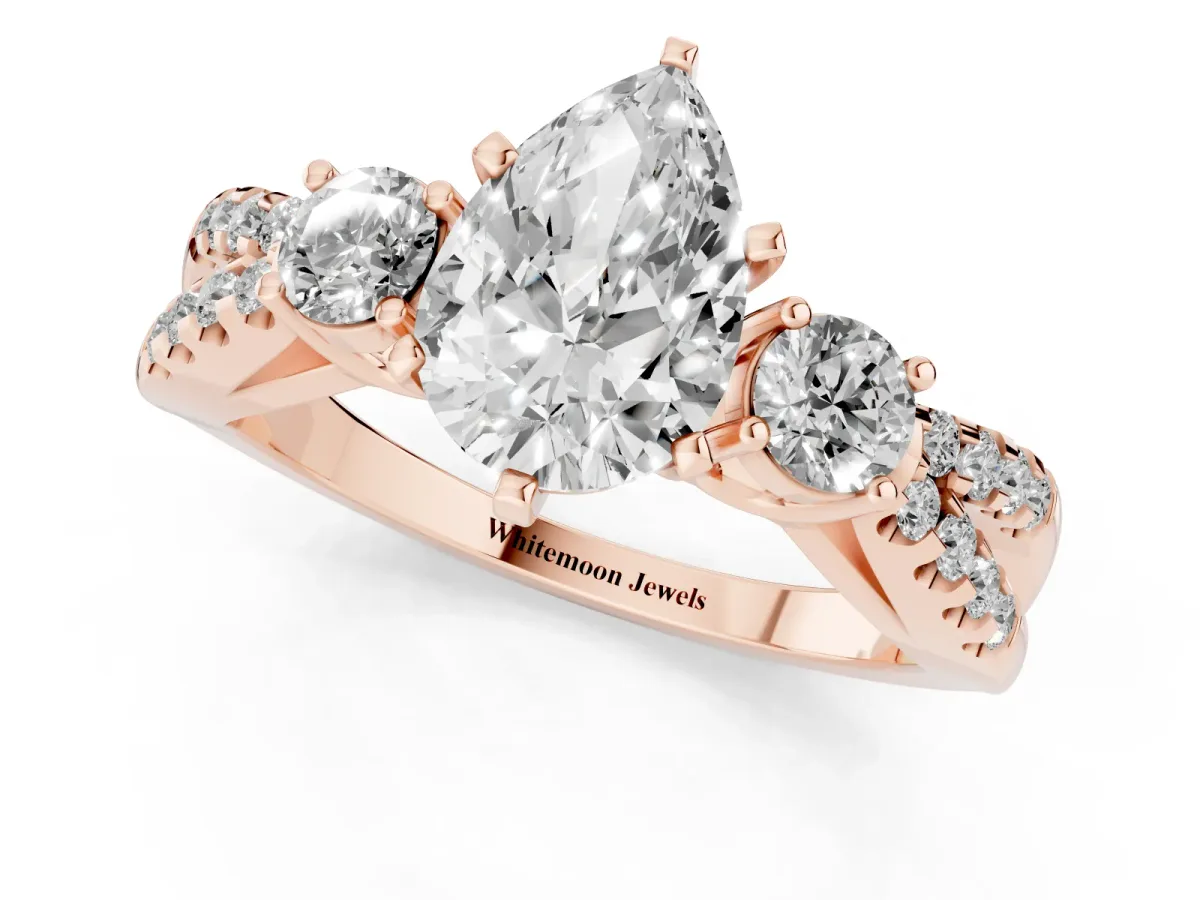 Pear Cut Diamond Three-Stone Ring with Pavé Split Shank and Four-Prong Setting Rose gold
