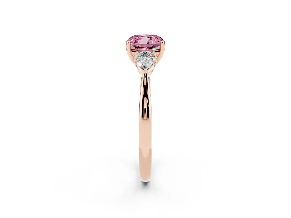 Fancy Pink Three-Stone Cushion Cut Diamond Ring with Pear Side Stones in Four-Prong Setting Rose gold