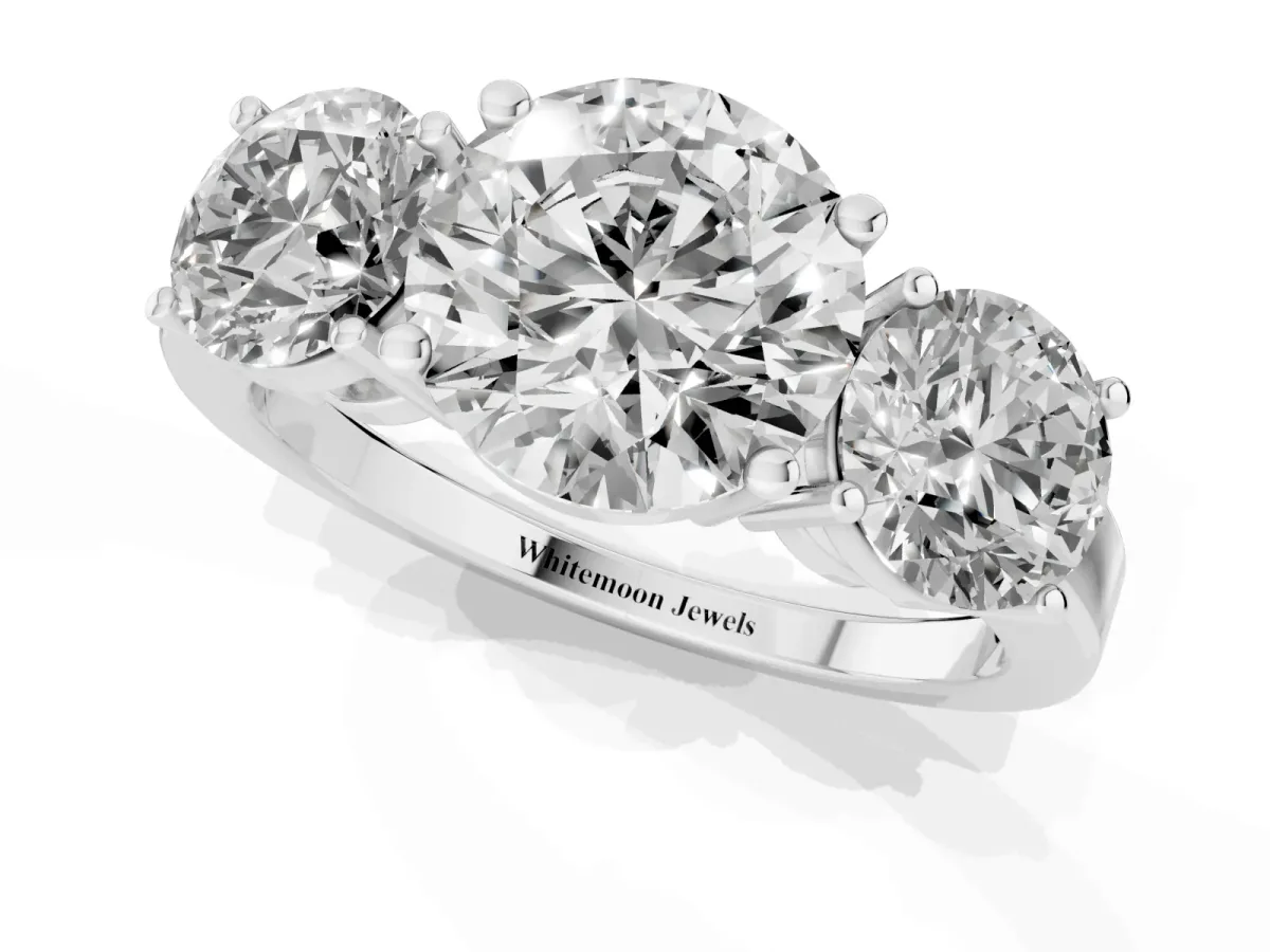 Three-Stone Round Cut Cut Diamond Engagement Ring with Flat Band and Four-Prong Setting Silver