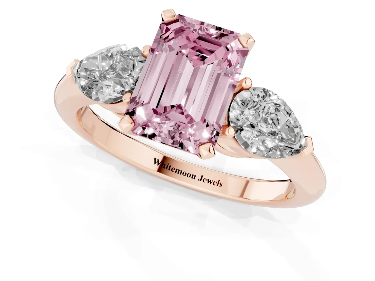 Fancy Pink Three-Stone Emerald Cut Diamond Ring with Pear Side Stones and Four-Prong Setting Rose gold