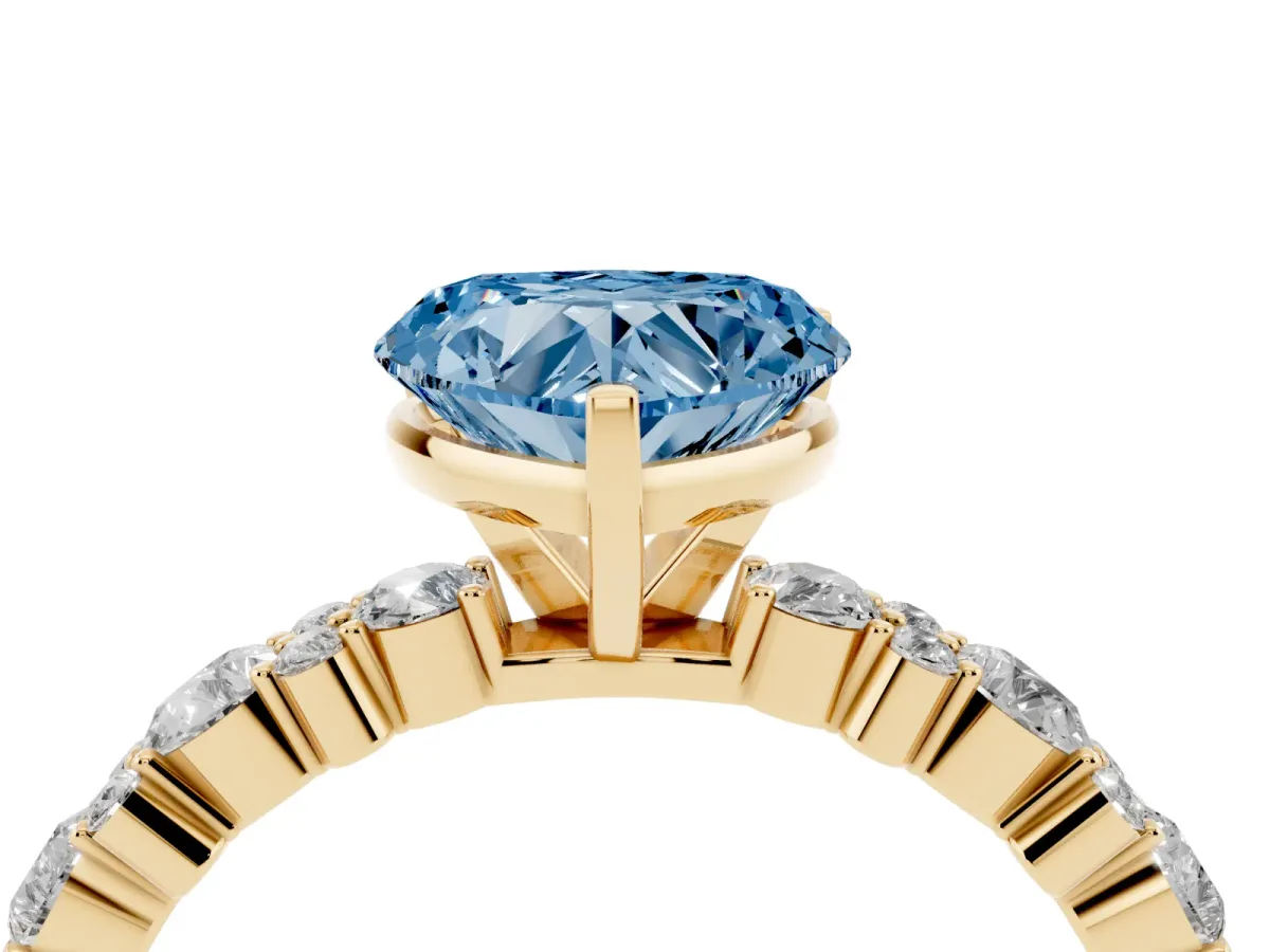 Fancy Blue Heart Cut Diamond Side Stone Solitaire Ring with Round and Four-Prong Setting Yellow gold