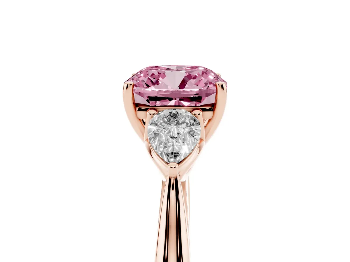 Fancy Pink Three-Stone Cushion Cut Diamond Ring with Pear Side Stones in Four-Prong Setting Rose gold