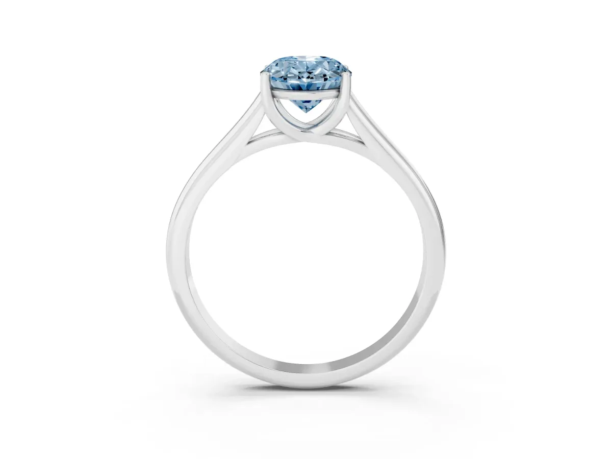Fancy Blue Oval Cut Solitaire Engagement Ring with Tapered Band and Four-Prong Setting Silver