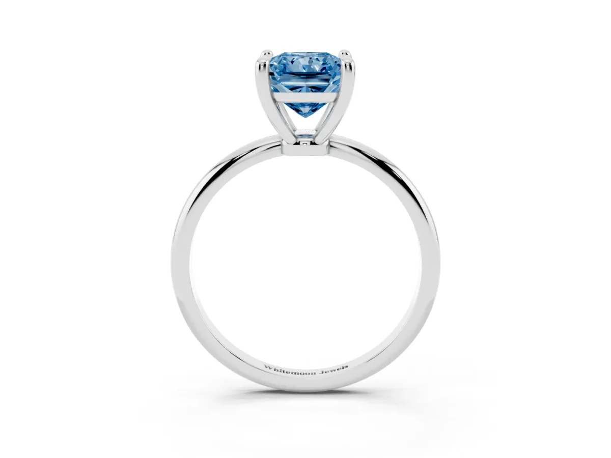 Fancy Blue Radiant Cut Solitaire Diamond Ring with 4-Prong Setting on a Classic Band Silver
