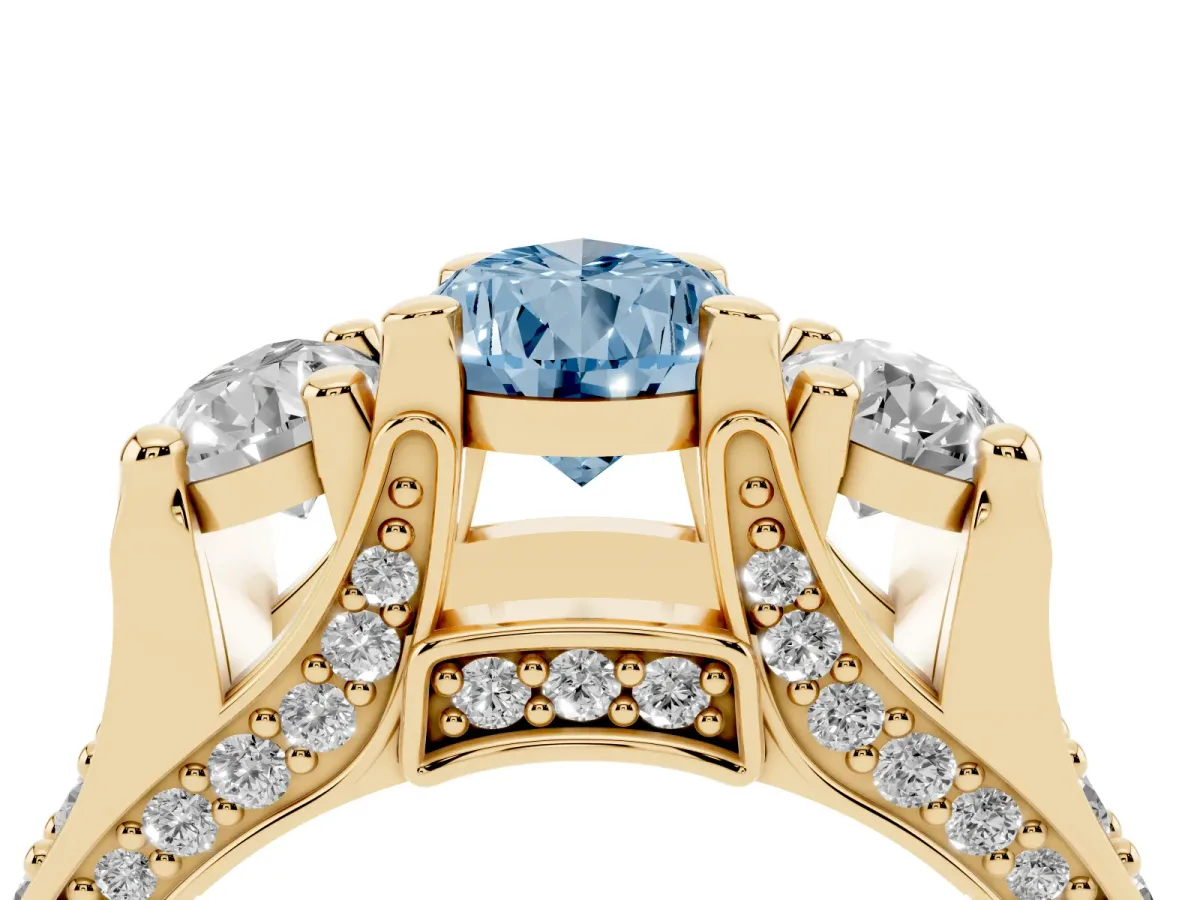Fancy Blue Pear Cut Diamond Three-Stone Ring with Channel Set Band and Four-Prong Setting Yellow gold