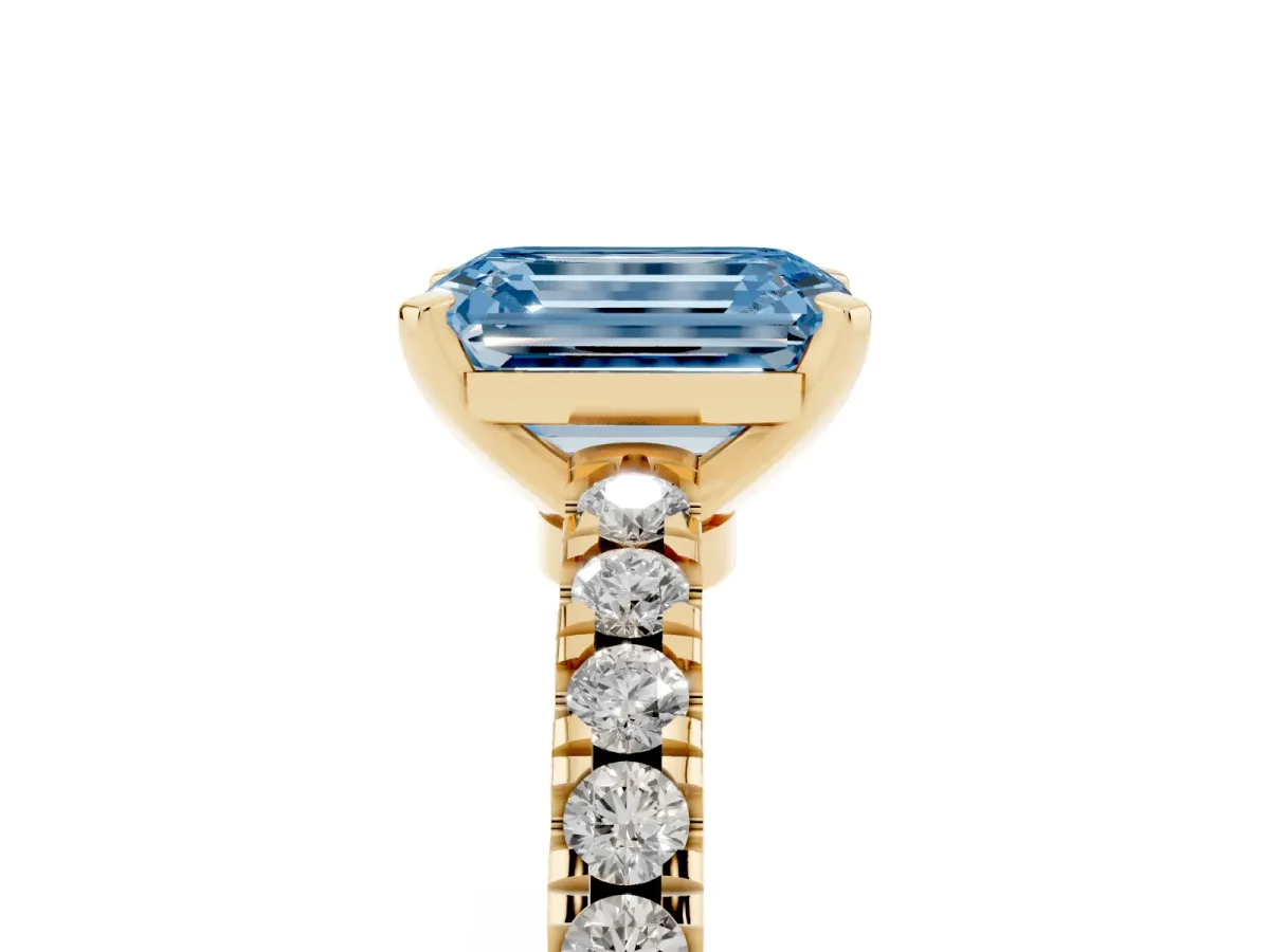 Fancy Blue Emerald Cut Solitaire Diamond with Pavé Band and Four-Prong Setting Yellow gold