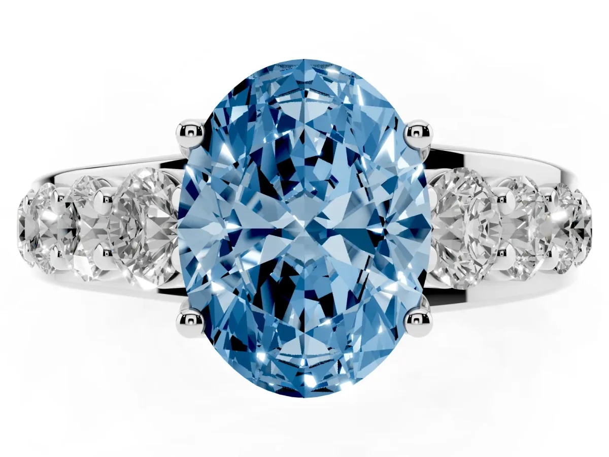Fancy Blue Oval Cut Diamond Engagement Ring with Pavé Band and Four-Prong Setting Silver