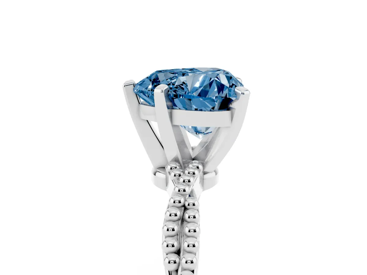 Fancy Blue Heart Cut Solitaire Twisted Band with Bead Prong Setting Platinum