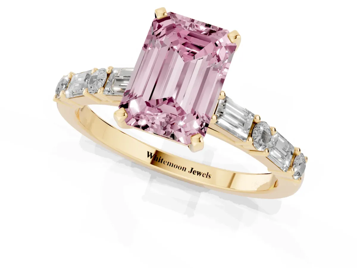 Fancy Pink Emerald Cut Diamond Solitaire with Side Baguettes and Channel Set Band Yellow gold
