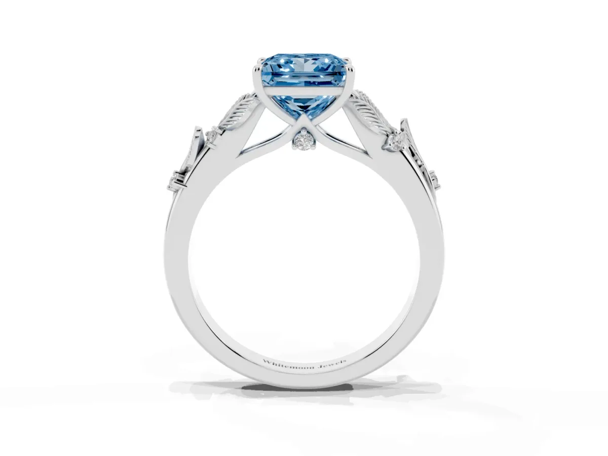 Fancy Blue Princess Cut Diamond Solitaire Ring with Leaf Motif Band and Four-Prong Setting Silver