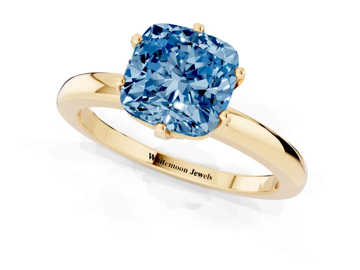 Fancy Blue Cushion Cut Solitaire Diamond Ring with Six-Prong Setting on a Classic Band Yellow gold