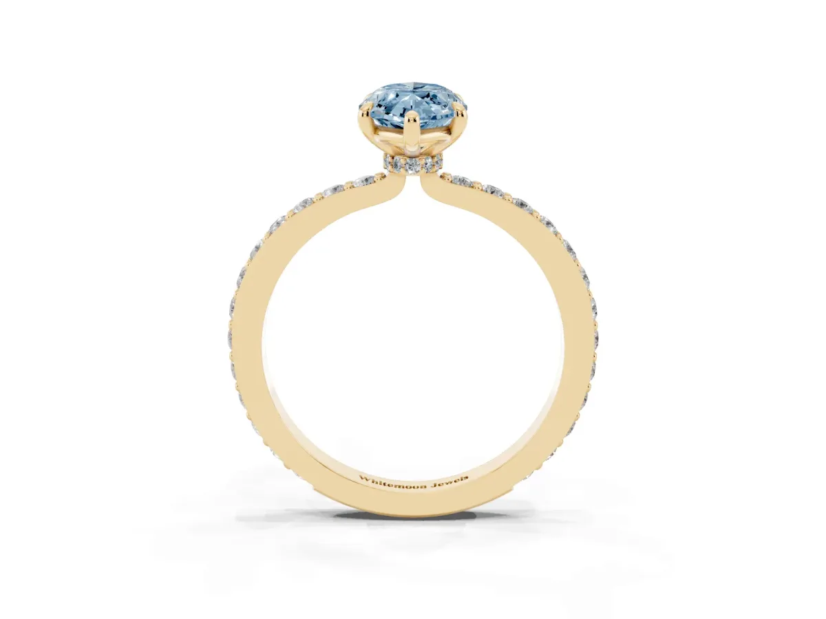 Fancy Blue Marquise Cut Diamond Pavé Engagement Ring with Round Accents and Prong Setting Yellow gold