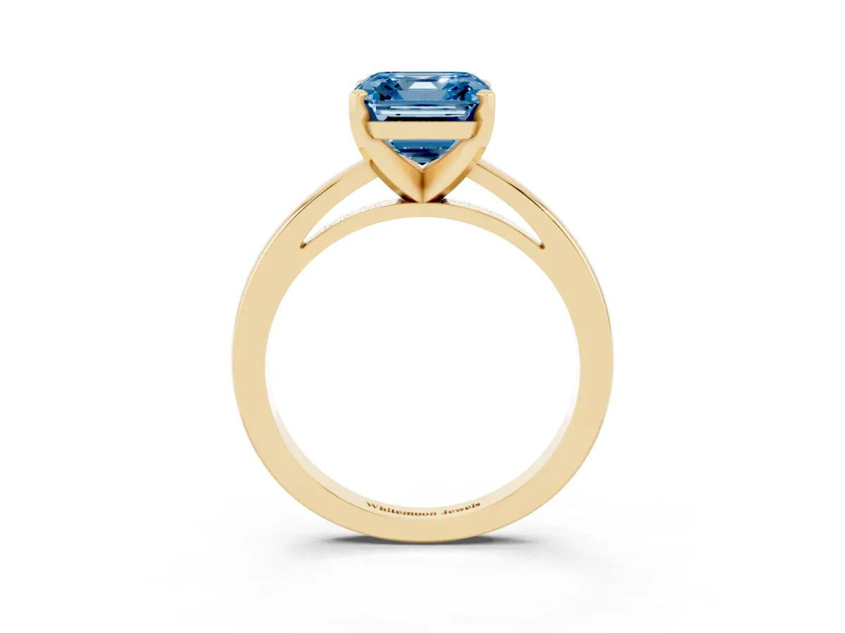 Fancy Blue Asscher Cut Solitaire Diamond Engagement Ring with Four-Prong Setting on a Classic Band Yellow gold