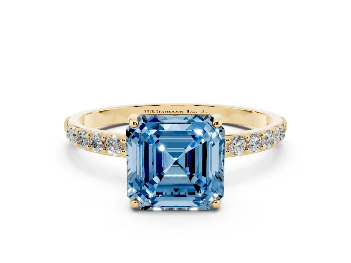 Fancy Blue Asscher Cut Diamond Solitaire Ring with Round Pavé Shoulders and Prong Setting Yellow gold