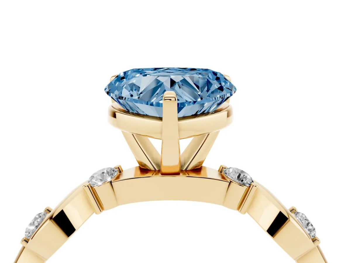 Fancy Blue Heart Cut Diamond Solitaire Twisted Band with Round Accents and Prong Setting Yellow gold