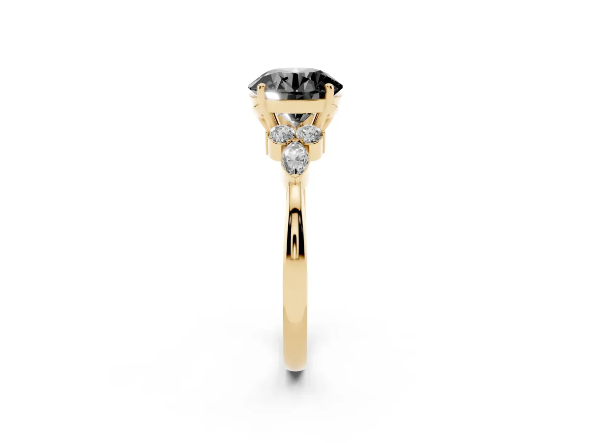 Fancy Black Round Cut Brilliant Diamond Solitaire Ring with Pear Side Stones and Four-Prong Setting Yellow gold