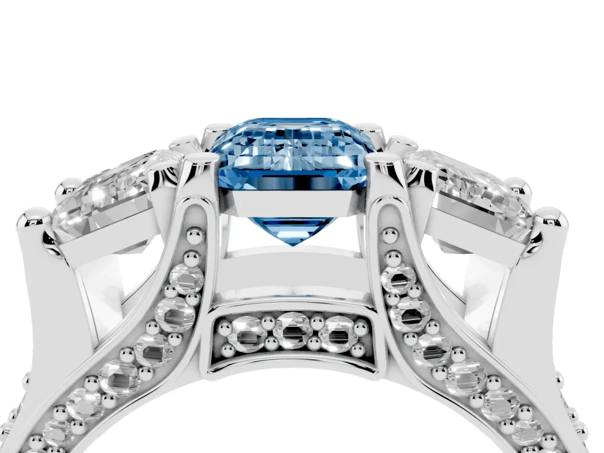 Fancy Blue Emerald Cut Diamond Three-Stone Ring with Channel Set Band and Four-Prong Setting Silver