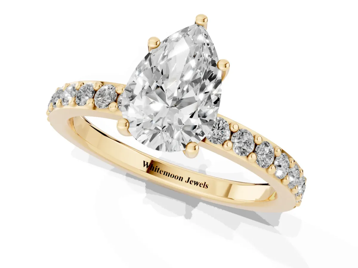 Pear Cut Cut Diamond Solitaire with Pave Band and Four-Prong Setting Yellow gold