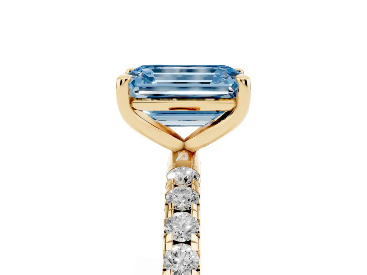 Fancy Blue Emerald Cut Cut Diamond Solitaire Ring with Micro Pave Band and Four Prong Setting Yellow gold