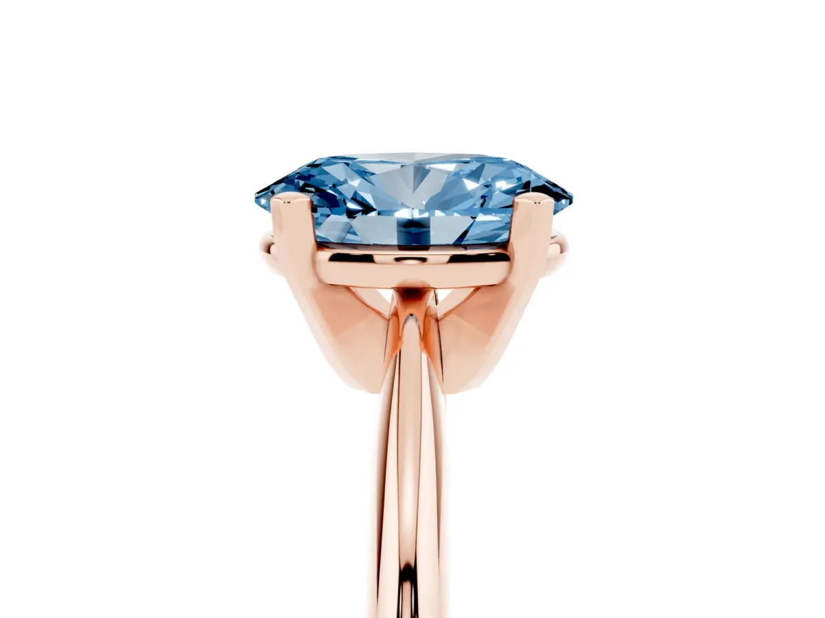 Fancy Blue Oval Cut Cut Solitaire Ring with Four-Prong Setting on a Classic Band Rose gold