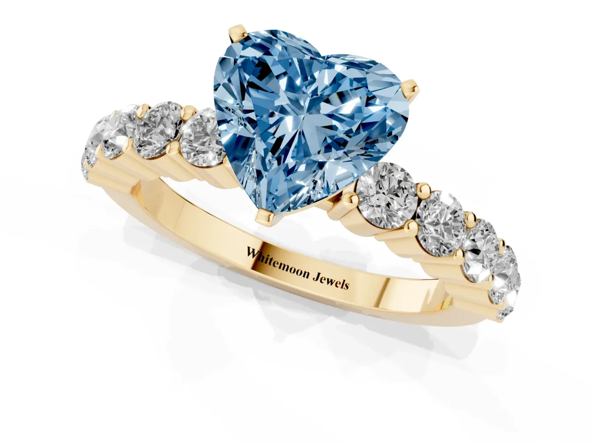 Fancy Blue Heart Cut Diamond Solitaire Ring with Shared Prong Round Side Stones Yellow gold